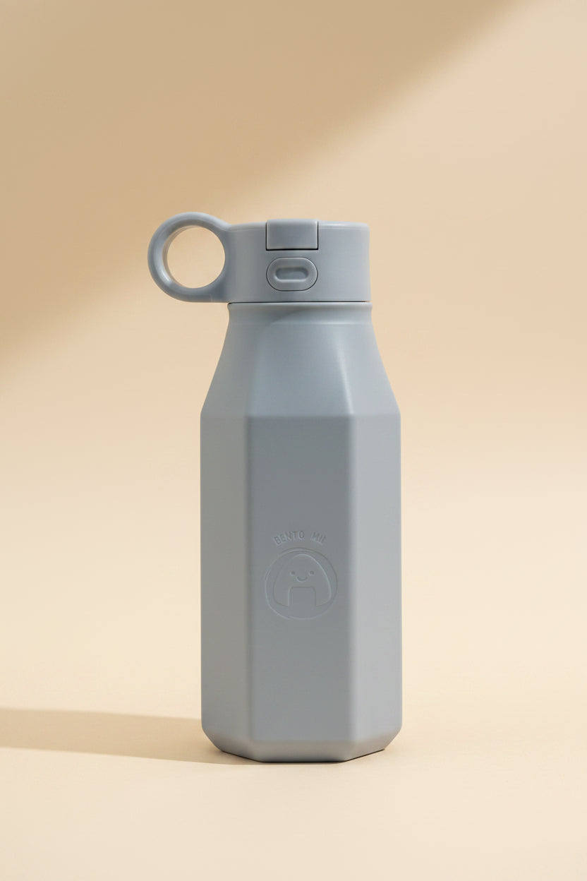 A light grey silicone water bottle