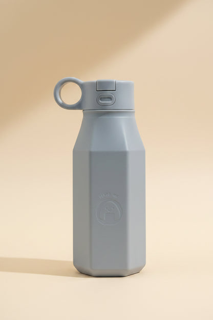 A light grey silicone water bottle