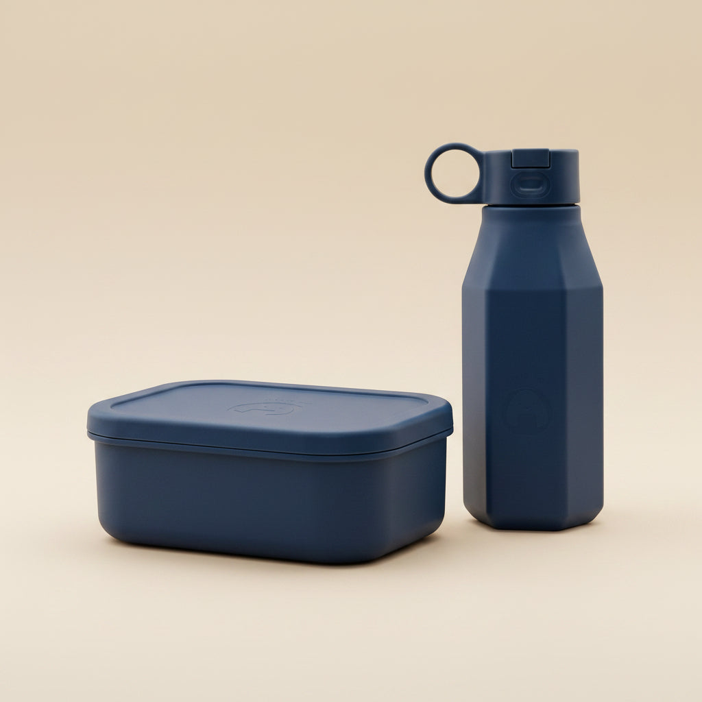 A navy-blue bento lunchbox and water bottle set for kids