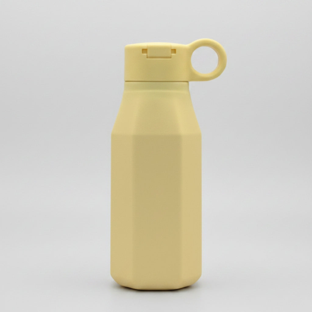 A pastel yellow silicone water bottle with a pastel color, displayed emphasizing its eco-friendly and reusable attributes.