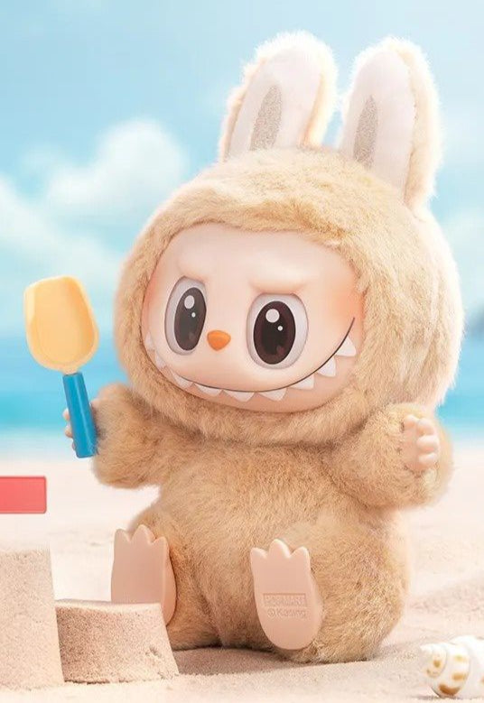 plush toys in bunny costumes on a beach with 'Have A Seat' 