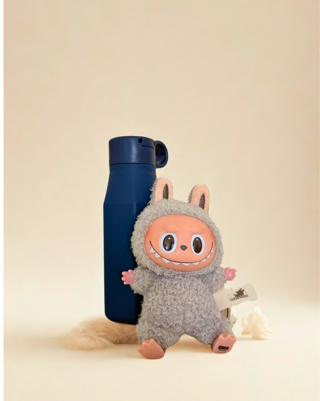 Labubu with navy blue water bottle 