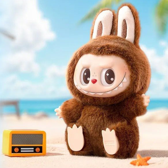 Brown plush toy with rabbit ears on a beach with text about a secret edition figurine.